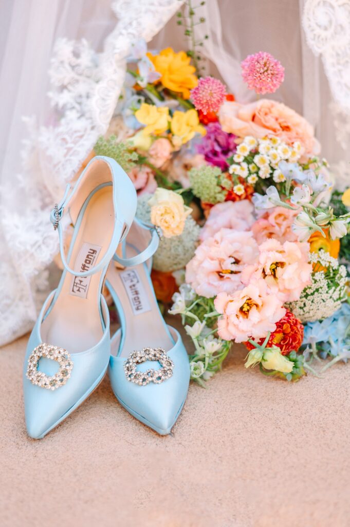 blue tiffany wedding heels next tot eh wedding boutique on pink stucco