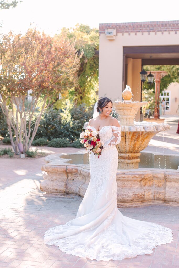 Bride standing in front of fountain in Old Town